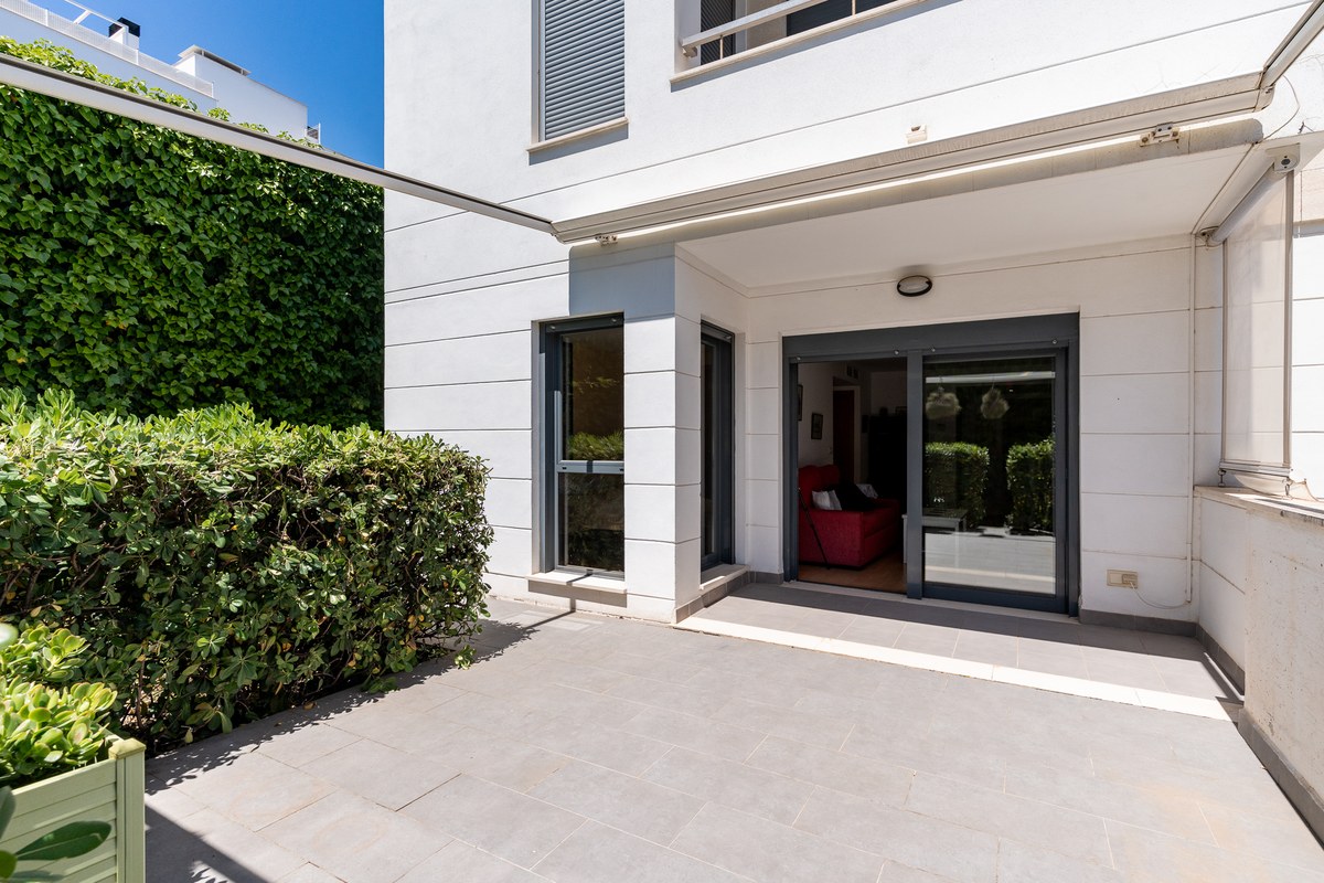 Ground-floor living room opening to the terrace