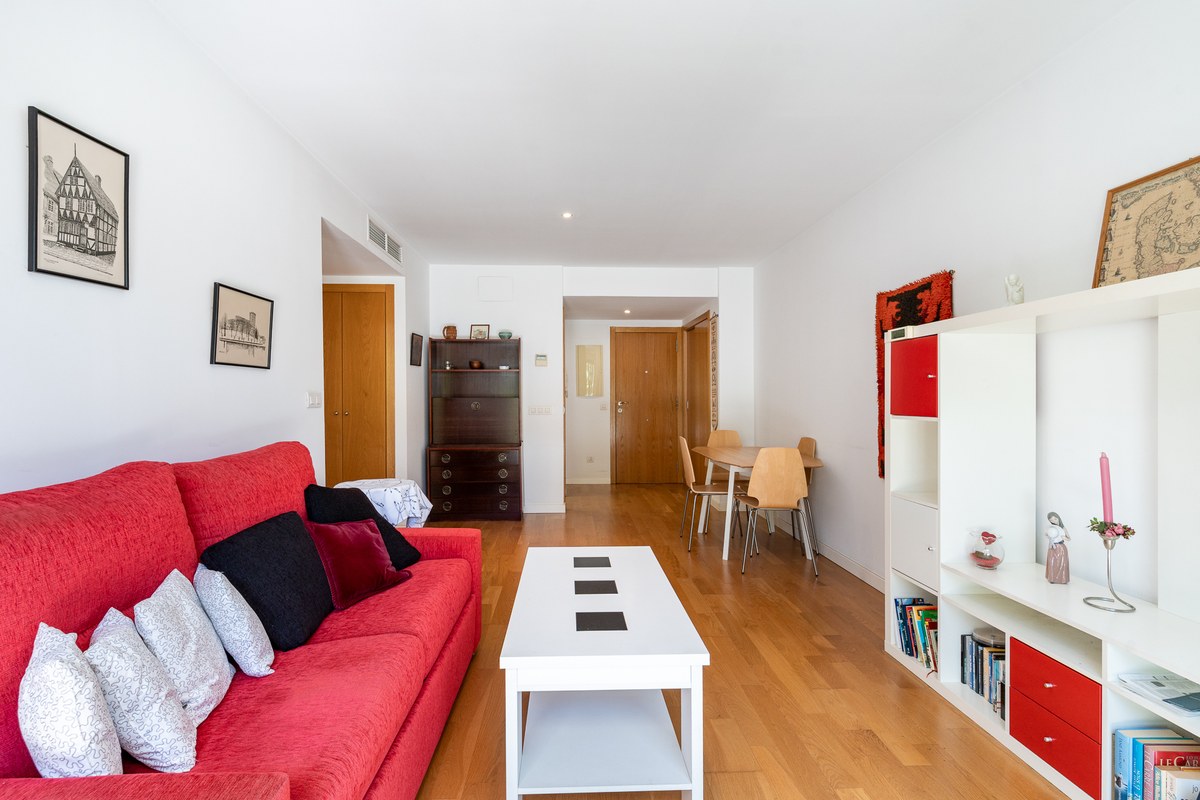 11-living-dining-room-red-sofa-entrance-1200×800 El Jardín — Garden Apartment in Son Rapinya