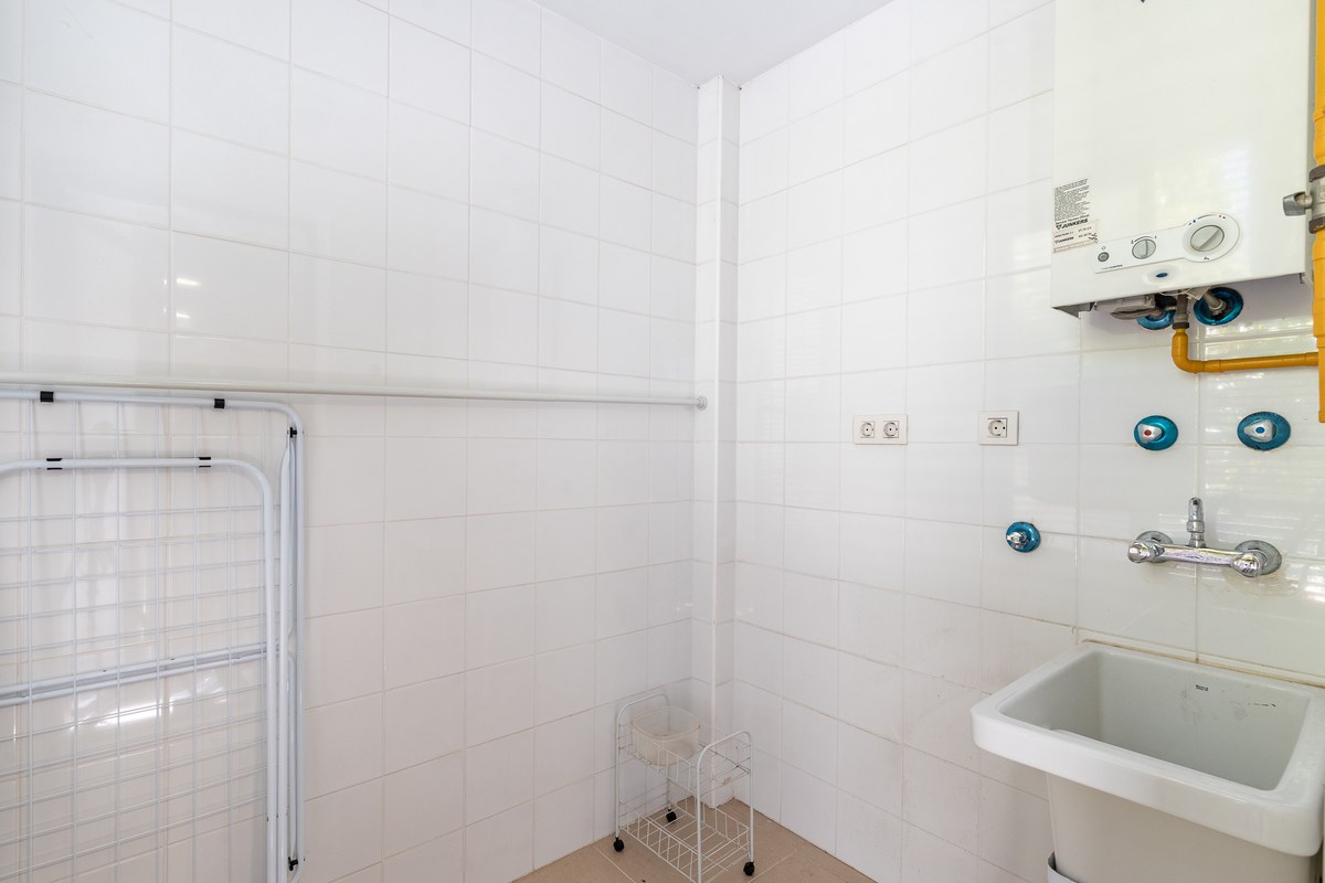 16-utility-laundry-room-water-heater-1200×800 El Jardín — Garden Apartment in Son Rapinya