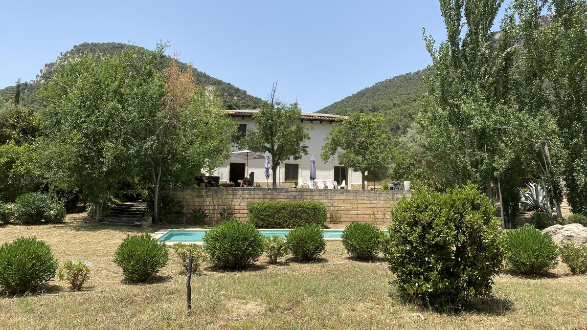 The garden and pool at Casa Son Cabaspre with the house behind