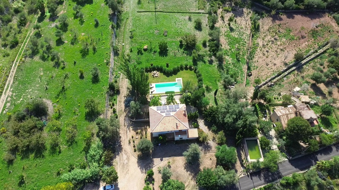 Casa Son Cabaspre at sunset, the pool and the house below the Tramuntana