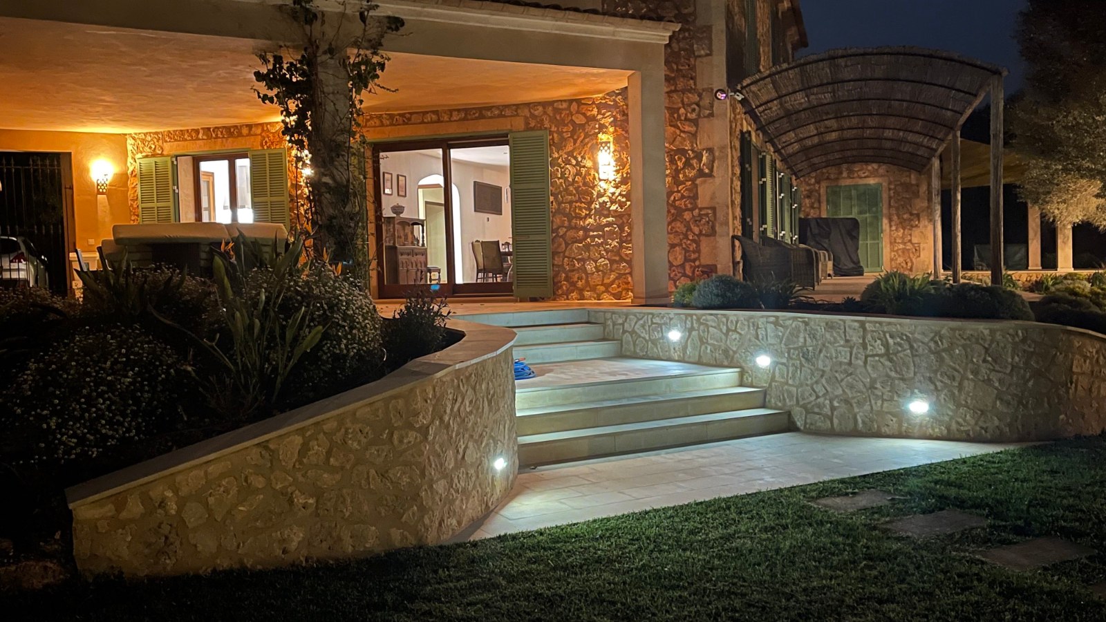 The finca at Los Hibiscus after dark with the doors open onto the terrace
