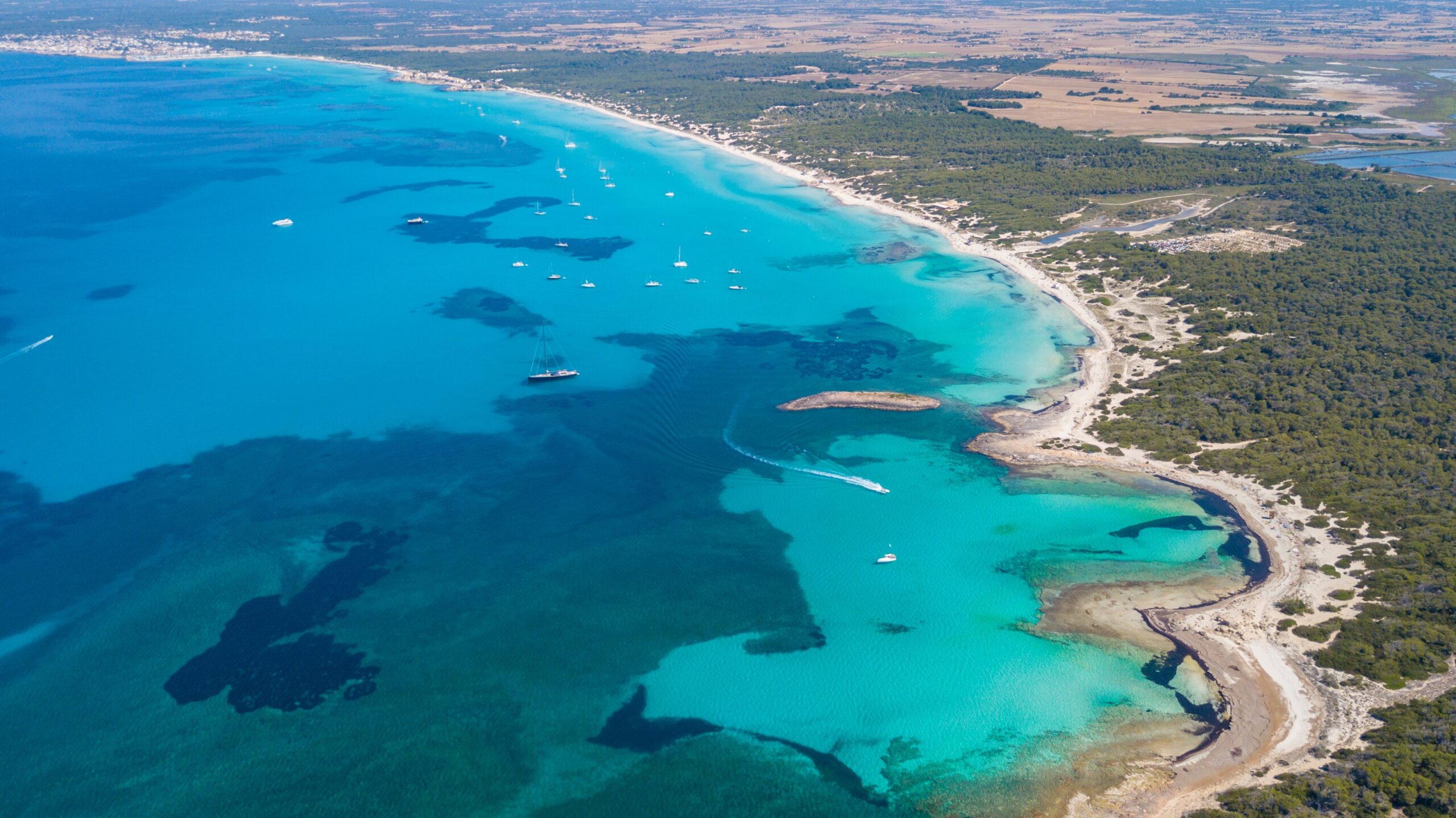Es Trenc from the air, turquoise water along a long white beach