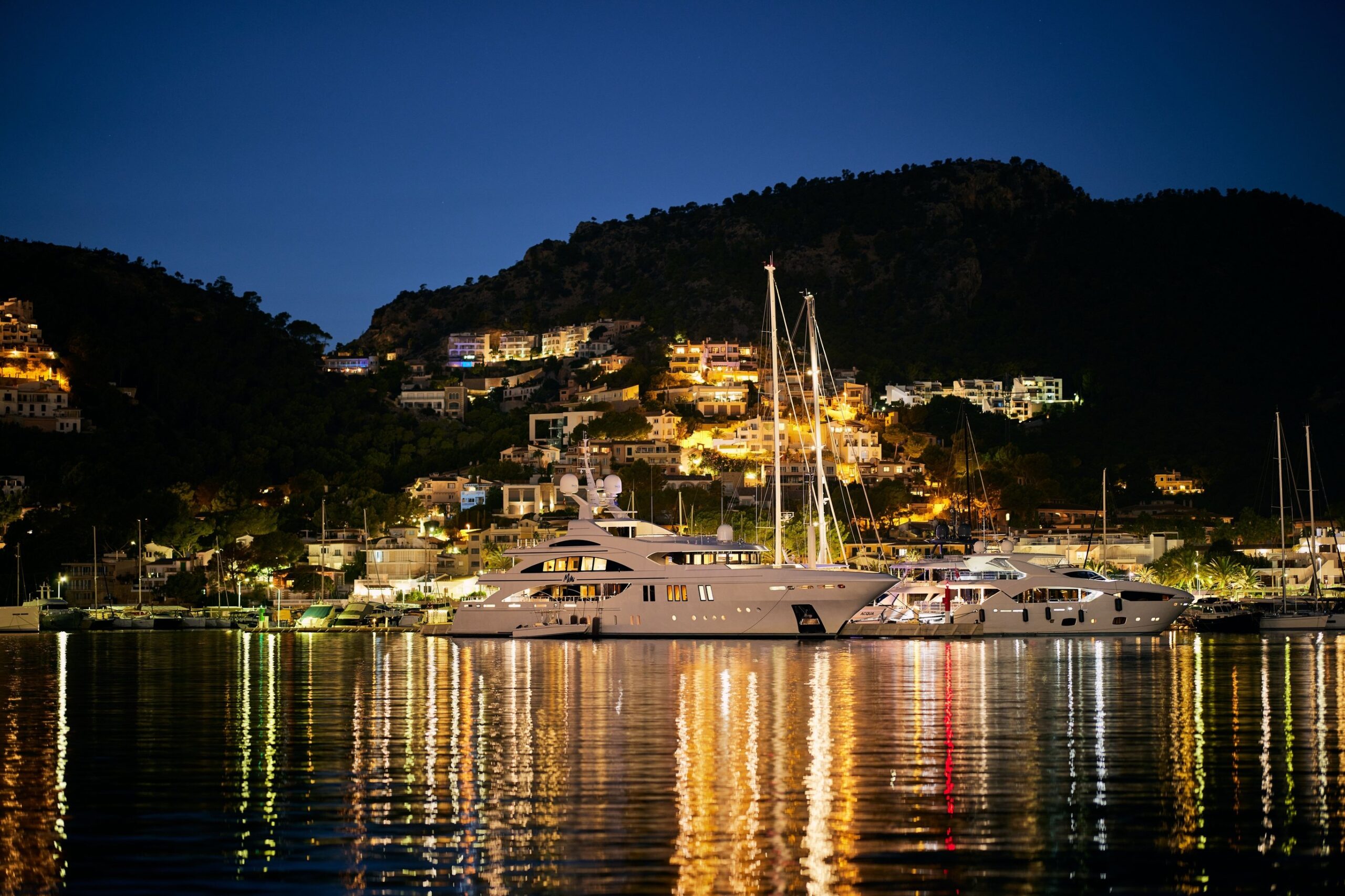 The harbour of Port d'Andratx at night, the homes lit on the hill