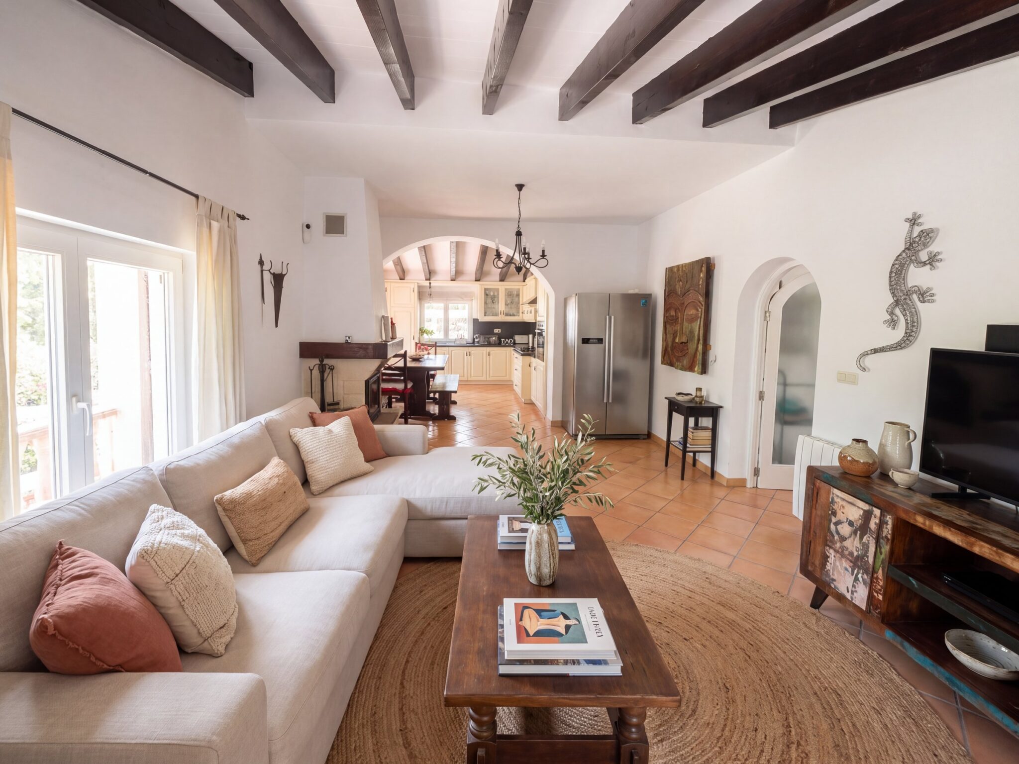 The living room under stone arches and wooden beams — visualisation