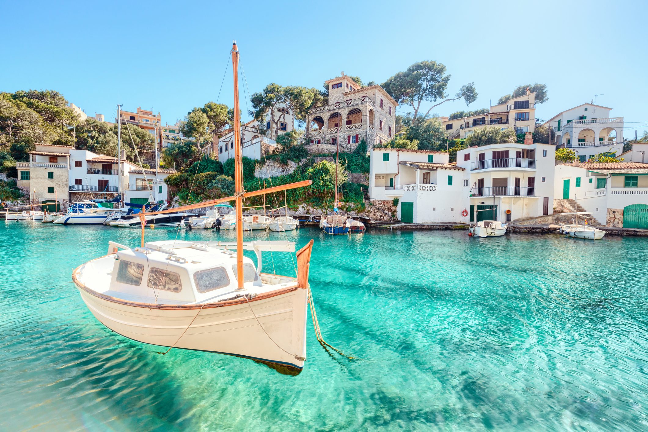 A boat in a turquoise cove in Mallorca